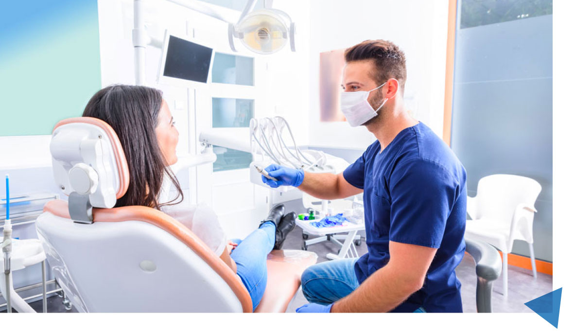 Dentist Performing Tooth Extraction Treatment In Athens, AL