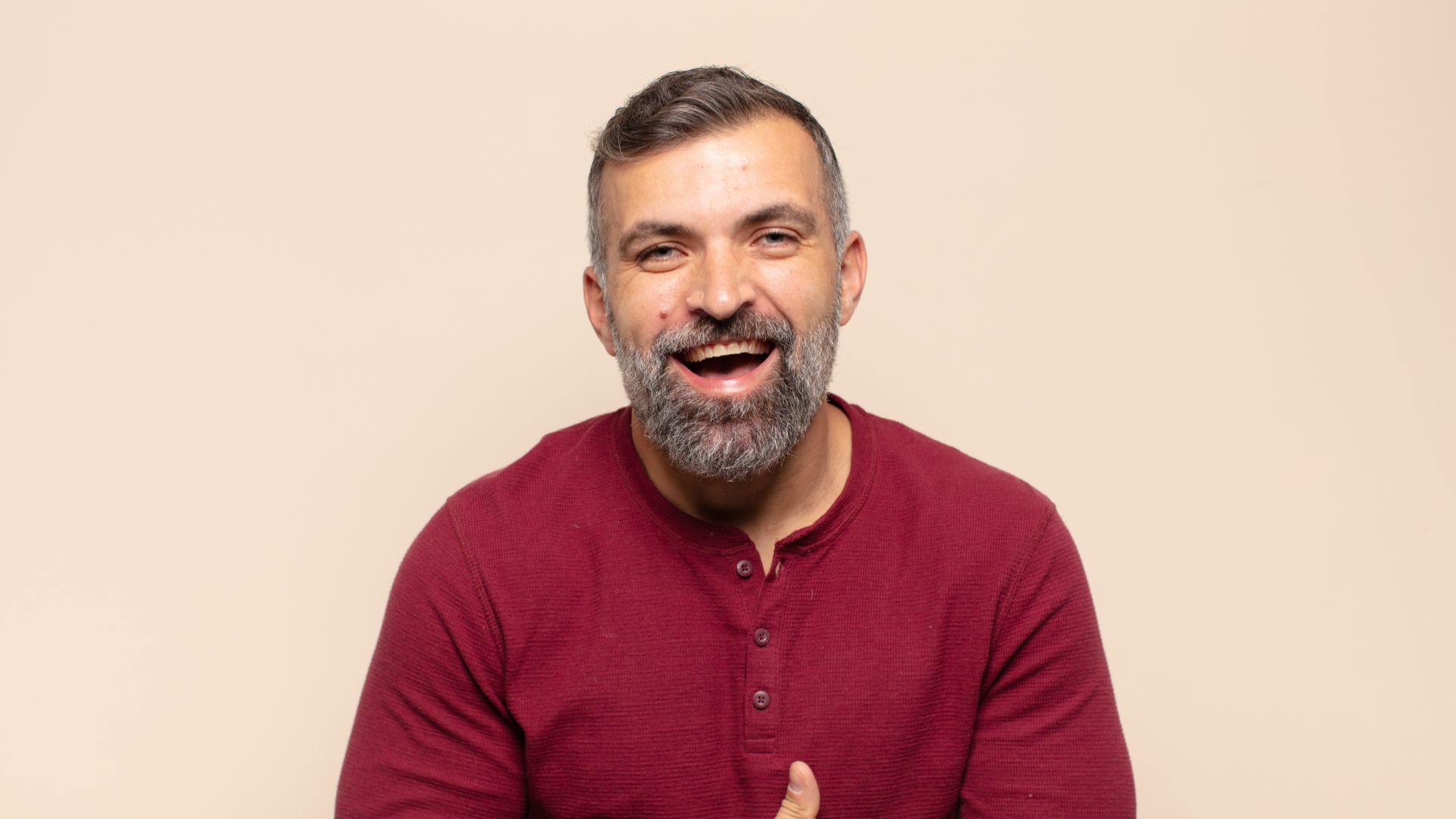 Man Smiling After Dental Crown Treatment